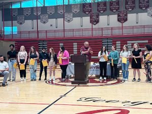 Members of softball team receive awards from coach 