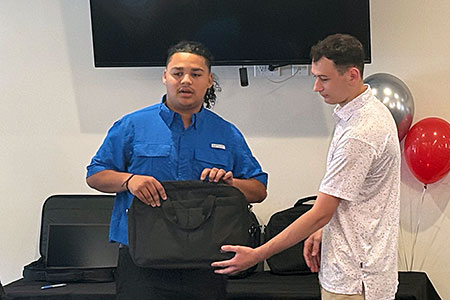 Student is presented with a laptop bag