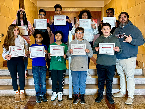 September students of the month hold their award certificates