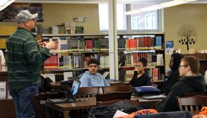 Labor union rep speaks with students in the library